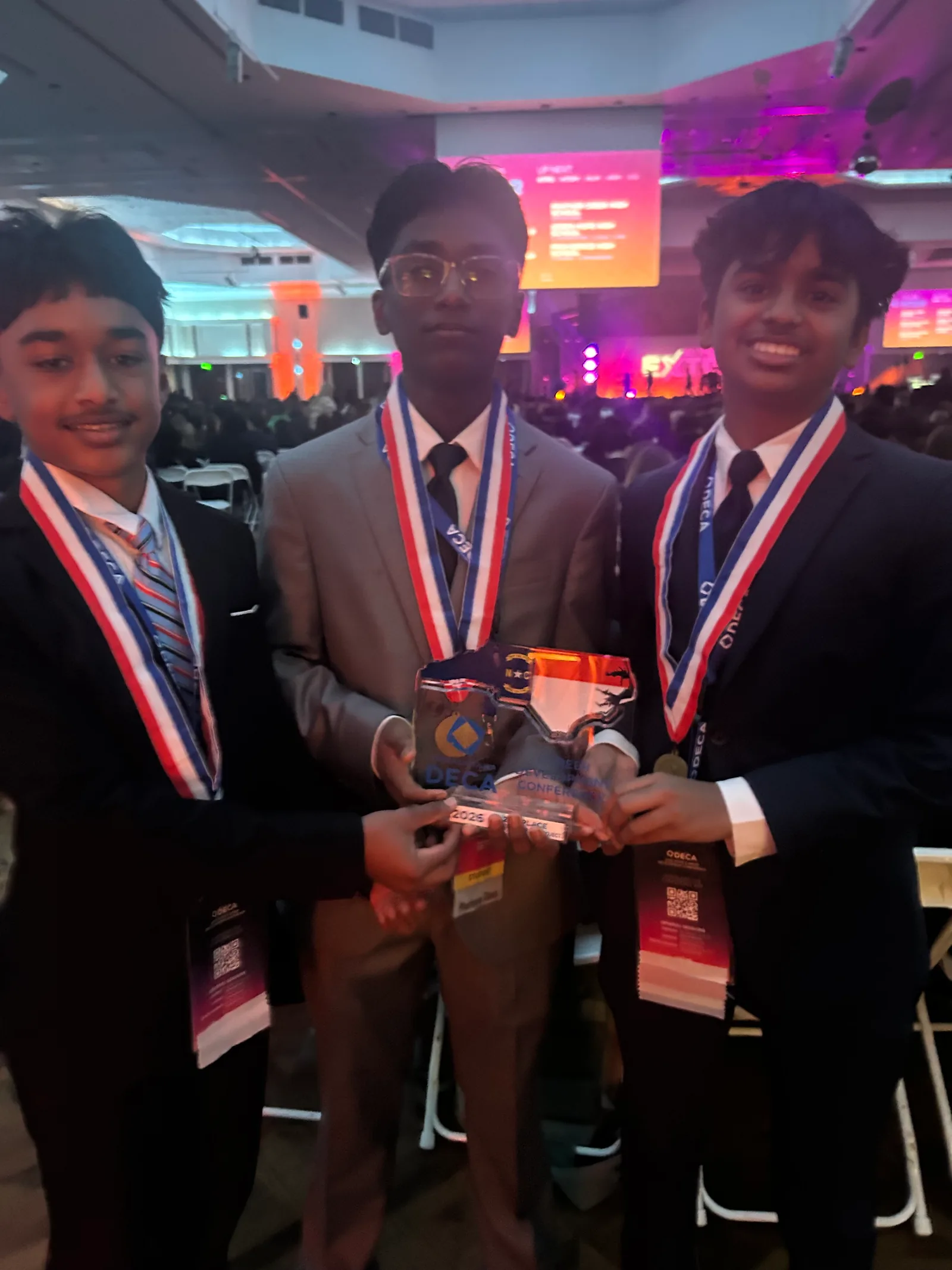 The VisioCourt team holding its second-place award at DECA States.